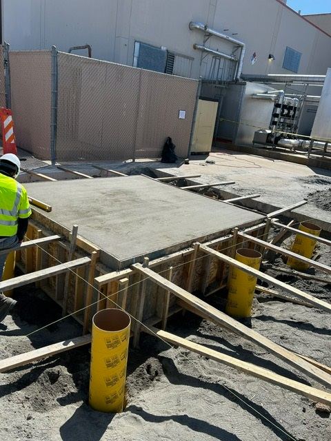 Concrete pour for an equipment tank pad
